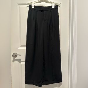 Woman’s wide leg black dress pants.